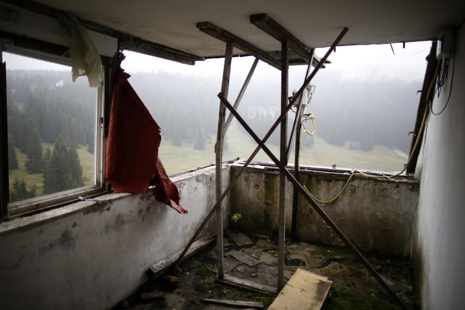 REFILE CORRECTING TYPO IN SARAJEVO A view of the disused judges room for the ski jump from the Sarajevo 1984 Winter Olympics on Mount Igman, near Sarajevo September 19, 2013. Abandoned and left to crumble into oblivion, most of the 1984 Winter Olympic venues in Bosnia's capital Sarajevo have been reduced to rubble by neglect as much as the 1990s conflict that tore apart the former Yugoslavia. The bobsleigh and luge track at Mount Trebevic, the Mount Igman ski jumping course and accompanying objects are now decomposing into obscurity. The bobsleigh and luge track, which was also used for World Cup competitions after the Olympics, became a Bosnian-Serb artillery stronghold during the war and is nowadays a target of frequent vandalism. The clock is now ticking towards the 2014 Winter Olympics, with October 29 marking 100 days to the opening of the Games in the Russian city of Sochi. Picture taken on September 19, 2013. REUTERS/Dado Ruvic (BOSNIA AND HERZEGOVINA - Tags: SOCIETY SPORT OLYMPICS SKIING) ATTENTION EDITORS: PICTURE 19 OF 23 FOR PACKAGE 'SARAJEVO'S WINTER OLYMPIC LEGACY'. TO FIND ALL IMAGES SEARCH 'DADO IGMAN'