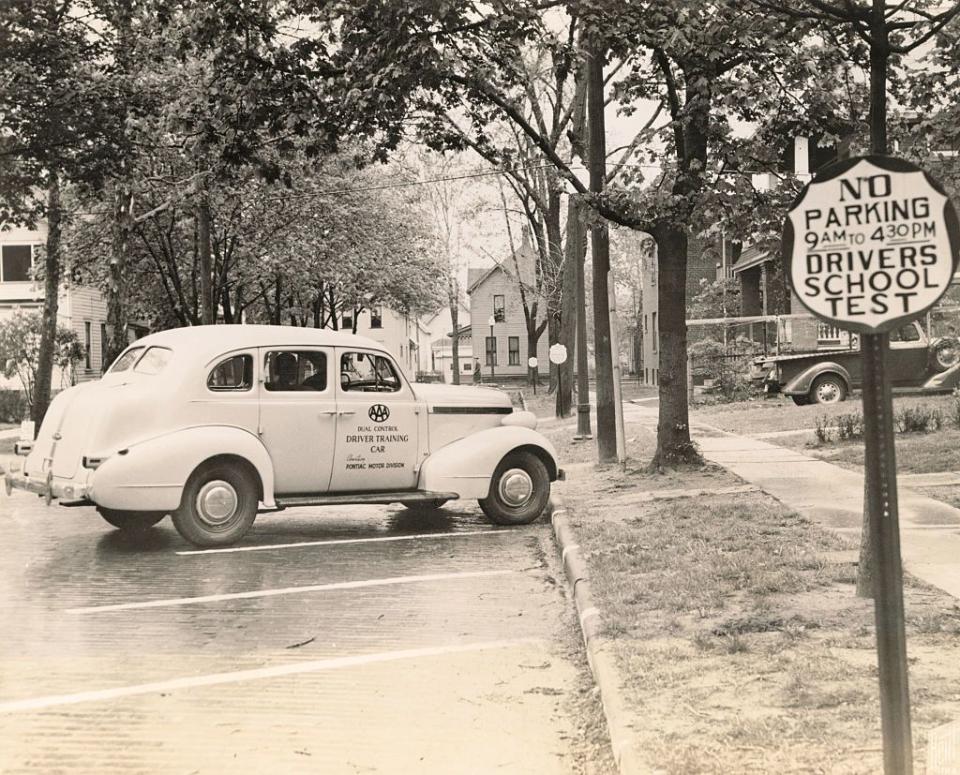 1930s driving school automobile parked in a parking lott