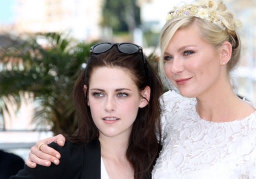 Actresses Kristen Stewart (left) and Kirsten Dunst pose during the photocall of "On the Road" at the 65th Cannes Film Festival on May 23. The film adaptation of Jack Kerouac's cult novel, a sex, drugs and booze-fuelled hymn to youthful freedom, hit the big screen in Cannes Wednesday with British actor Sam Riley in the driving seat