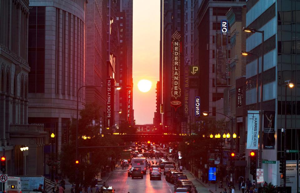 The setting sun is seen looking west on Randolph Street in Chicago on Friday, Sept. 20, 2019, just days before the autumnal equinox.