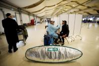 Passengers get tested for COVID-19 at Ben Gurion international airport