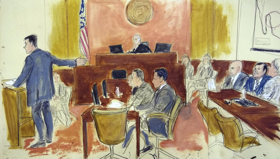 CORRECTS LAST OF ATTORNEY TO BALAREZO FROM BALAZERO - During his opening statement, Assistant U.S. Attorney Adam Feels, left, gestures to Joaquin "El Chapo" Guzman, second from right, sitting next to his attorney Eduardo Balarezo, at Brooklyn Federal Court, as Guzman's high-security trial got underway in the Brooklyn borough of New York, Tuesday, Nov. 13, 2018. The infamous Mexican drug lord has been held in solitary confinement since his extradition to the United States early last year. Guzman pleaded not guilty to charges that he amassed a multi-billion-dollar fortune smuggling tons of cocaine and other drugs in a vast supply chain that reached New York, New Jersey, Texas and elsewhere north of the border. (Elizabeth Williams via AP)