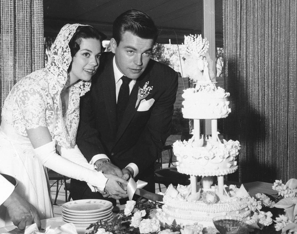 Actress Natalie Wood and actor Robert Wagner cut their wedding cake after their wedding in Scottsdale, Ariz., on Dec. 28, 1957. / Credit: AP Photo