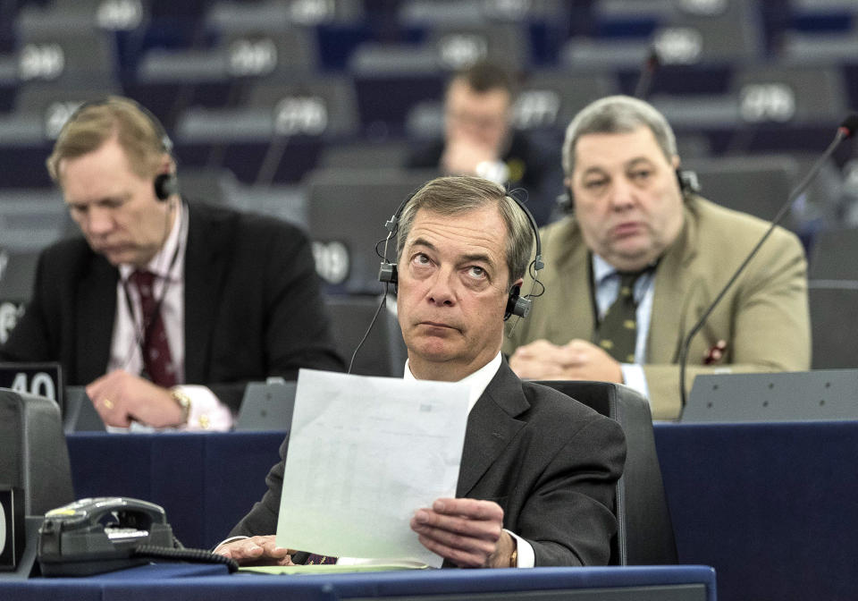 Former U.K. Independence Party (UKIP) leader Nigel Farage listens at the European Parliament during a debate on Brexit, Wednesday, Jan.16, 2019 in Strasbourg, eastern France. European Union Brexit negotiator Michel Barnier says the bloc is stepping up preparations for a chaotic no-deal departure of Britain from the bloc after the rejection of the draft withdrawal deal in London left the EU "fearing more than ever that there is a risk" of a cliff-edge departure. (AP Photo/Jean-Francois Badias)