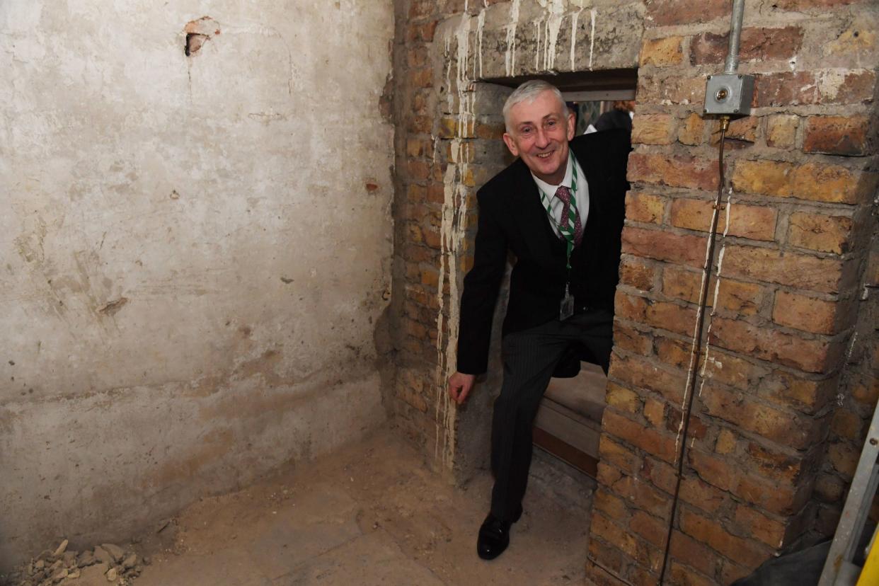 Speaker Lindsay Hoyle walks through a secret doorway that has been rediscovered in the House of Commons: PA