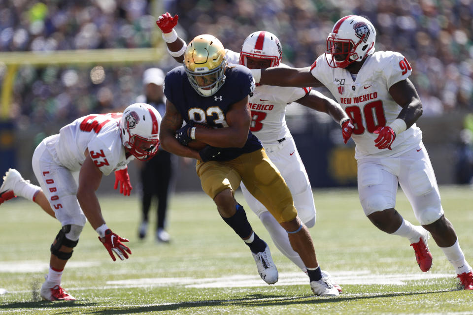 Notre Dame wide receiver Chase Claypool (83) outruns New Mexico defenders after in pass reception the first half of an NCAA college football game in South Bend, Ind., Saturday, Sept. 14, 2019. (AP Photo/Paul Sancya)