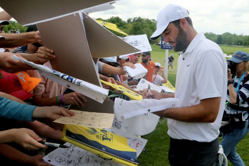 Scottie Scheffler signs autographs for fans during practice for the 2024 PGA Championship on Wednesday at Valhalla Golf Club on Thursday in Louisville, Ky. Photo by John Sommers II/UPI