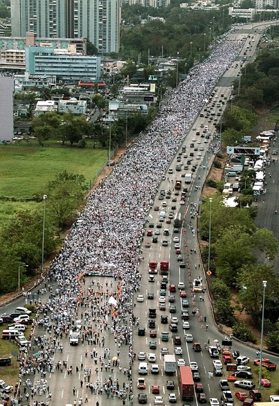 Thousands of citizens march in protest against President Clinton's decision to resume military training activities on the island of Vieques Puerto Rico