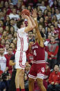 Wisconsin's Nate Reuvers (35) shoots against Indiana's Trayce Jackson-Davis (4) during the first half of an NCAA college basketball game Saturday, Dec. 7, 2019, in Madison, Wis. (AP Photo/Andy Manis)