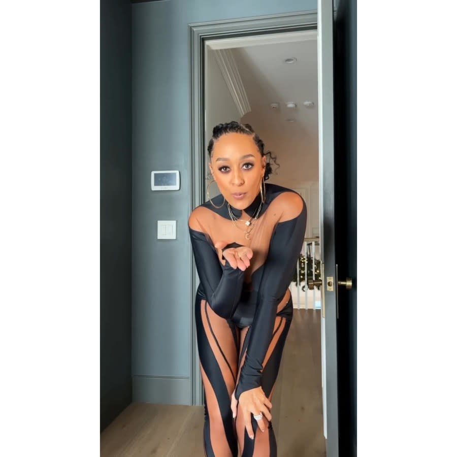 Tia Mowry Struts in Cutout Catsuit