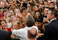 <p>President Obama holds crying baby during his visit to Iwakuni Marine Corps Air Station enroute to his Hiroshima trip, in Iwakuni, Japan, May 27, 2016. (Reuters/Carlos Barria ) </p>