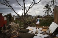 <p>Resident Mirian Medina stands on her property about two weeks after Hurricane Maria swept through the island on Oct. 5, 2017 in San Isidro, Puerto Rico. Residents in her section of the town remain without grid power or running water. Puerto Rico experienced widespread damage including most of the electrical, gas and water grid as well as agriculture after Hurricane Maria, a category 4 hurricane, swept through. (Photo: Mario Tama/Getty Images) </p>