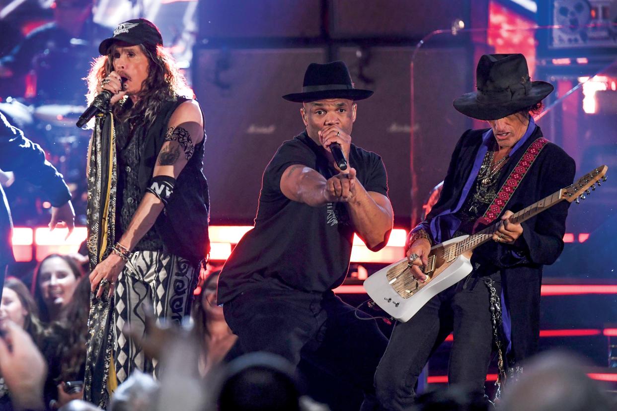 Steven Tyler and guitarist Joe Perry of Aerosmith and DMC (Darryl McDaniels) of Run DMC perform during the 62nd Annual Grammy Awards in 2020.