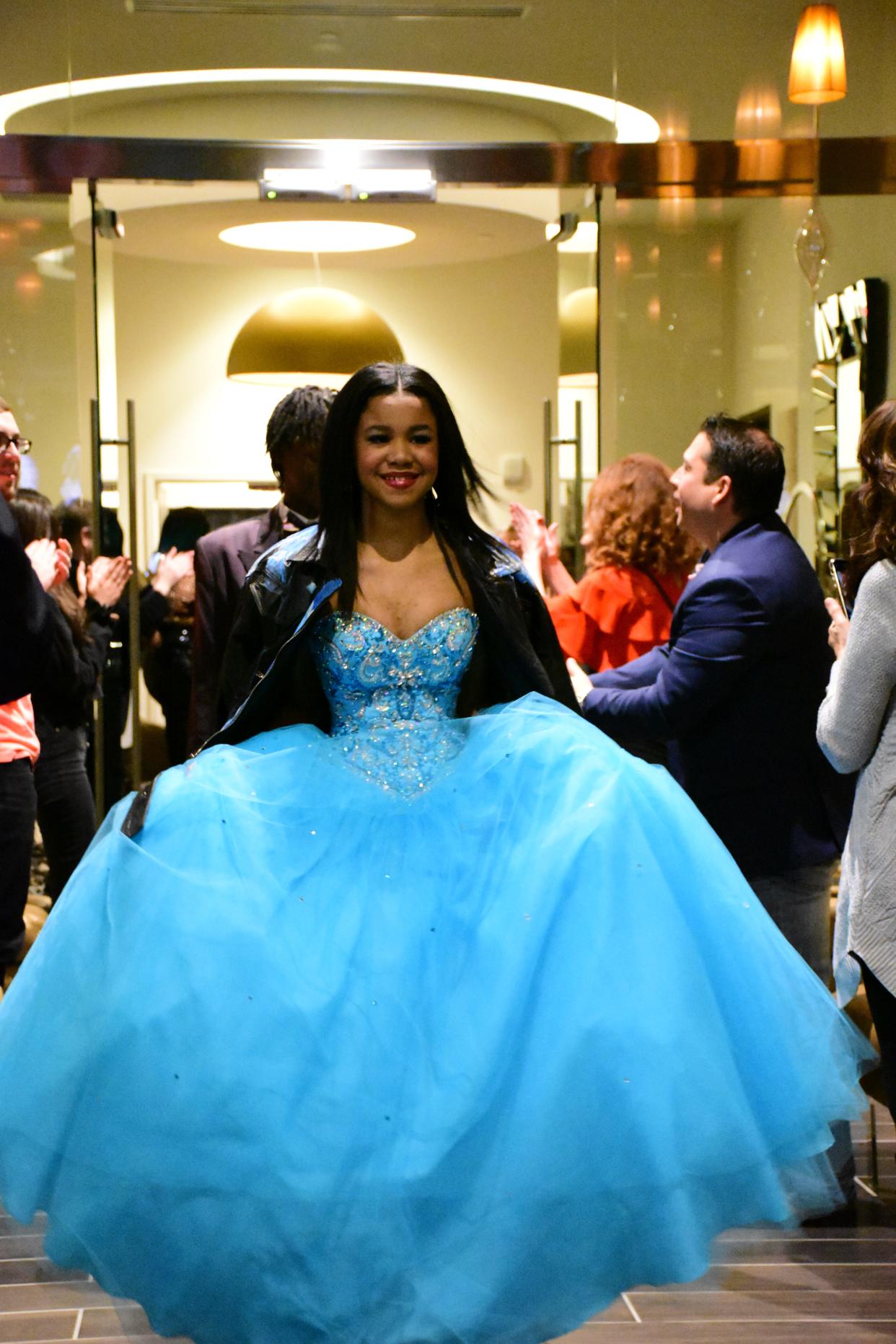 Annalise Houston walks the runway at the 2022 Fash Up fashion show, a fundraiser to buy prom tickets for Milwaukee high school students.