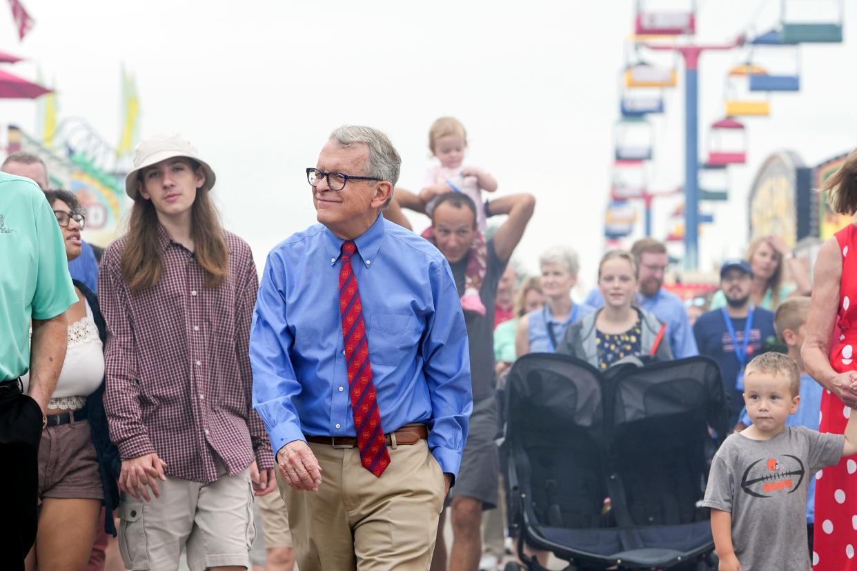 Gov. Mike DeWine tours the grounds during the opening day of the Ohio State Fair in Columbus. Adam Cairns-The Columbus Dispatch