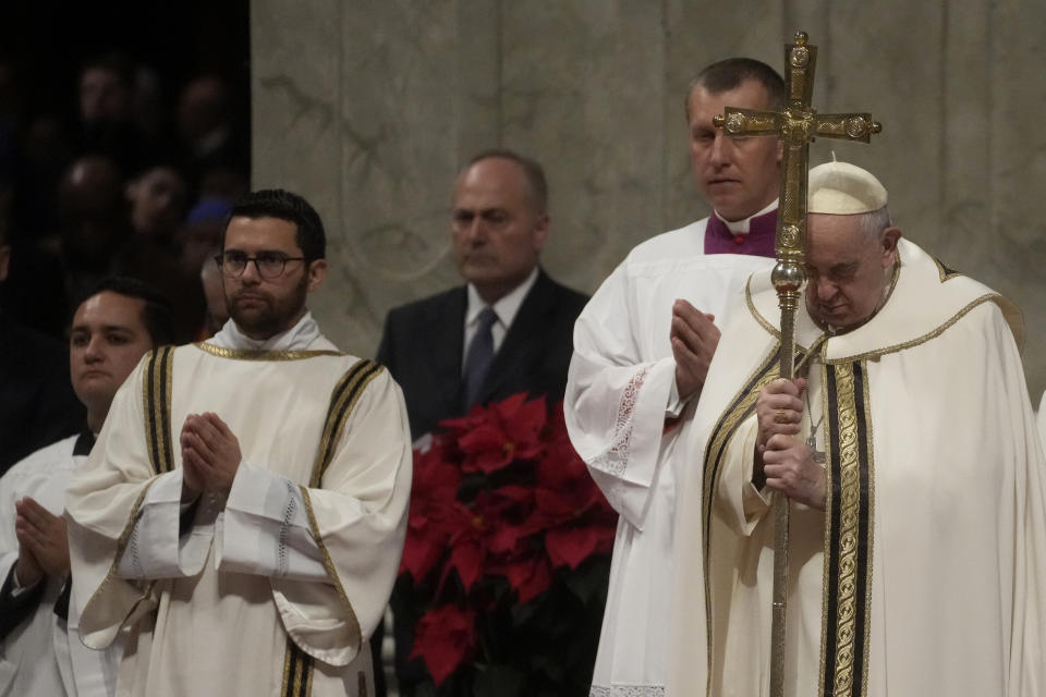 Pope Francis holds his pastoral staff as he presides over Christmas Eve Mass, at St. Peter's Basilica at the Vatican, Saturday Dec. 24, 2022. (AP Photo/Gregorio Borgia)