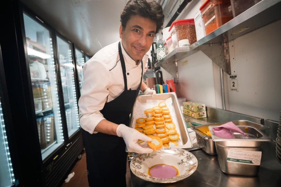 Chef Vikas Khanna in the kitchen prepping the mango ice cream dessert. Stefano Giovannini
