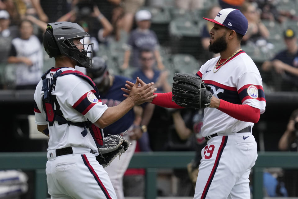 Chicago White Sox relief pitcher Keynan Middleton, right, celebrates with catcher Seby Zavala after the White Sox defeated the Boston Red Sox 4-1 in a baseball game in Chicago, Sunday, June 25, 2023. (AP Photo/Nam Y. Huh)