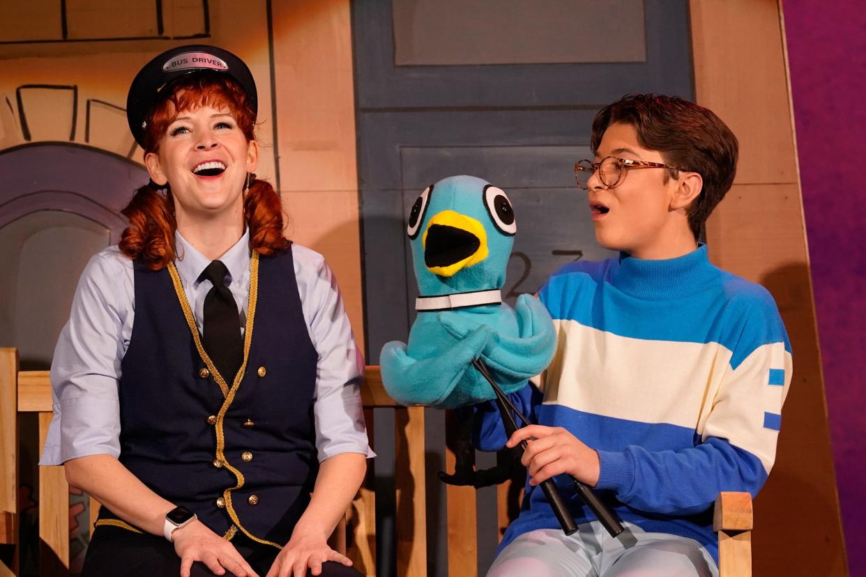 Kelly White as the bus driver explains to Reed Schwieterman as Pigeon why he can't drive the bus in a scene from "Don't Let the Pigeon Drive the Bus" at the Croswell Opera House. The musical is adapted from the children's book by Mo Willems.