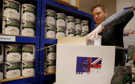 James Blake from emergency food storage.co.uk fills one of the company's 'Brexit Box' kits which contains dehydrated food, water purifying kit and fire starting gel at their warehouse in Leeds, Britain January 21, 2019. REUTERS/Phil Noble