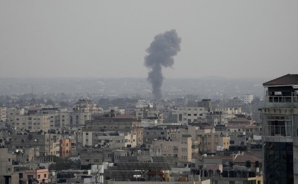 Smoke rises following Israeli airstrikes on a building in Gaza City, Friday, Aug. 5, 2022. Palestinian officials say Israeli airstrikes on Gaza have killed several people, including a senior militant, and wounded 40 others. (AP Photo/Hatem Moussa)