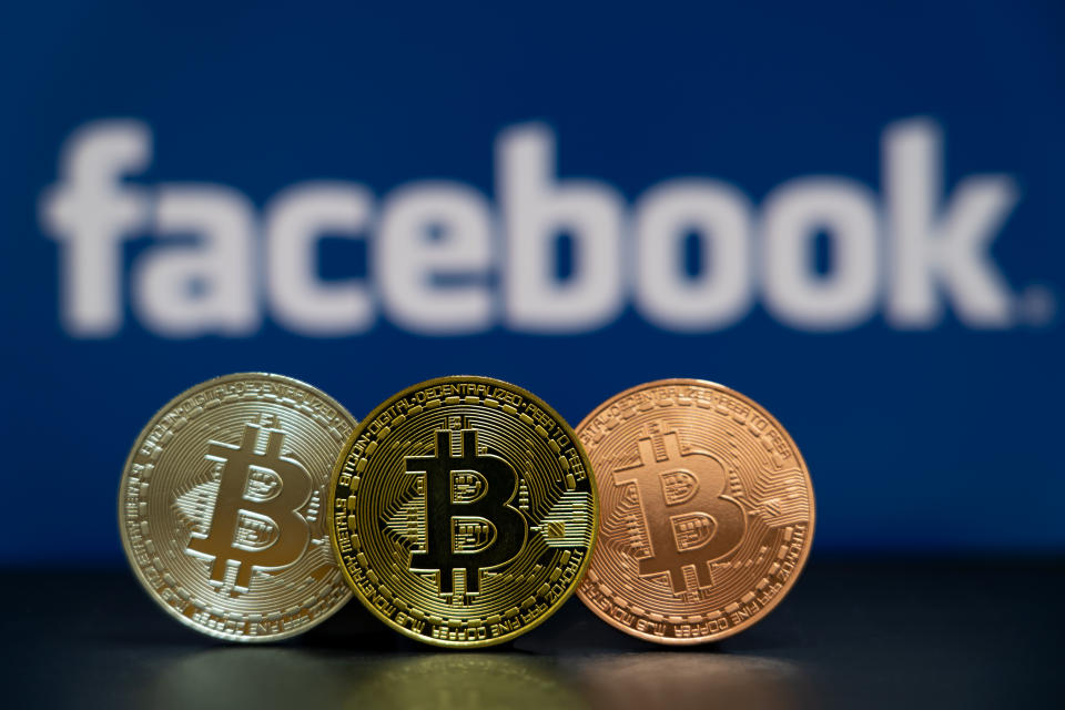 Bitcoin coin with the Facebook logo screen background