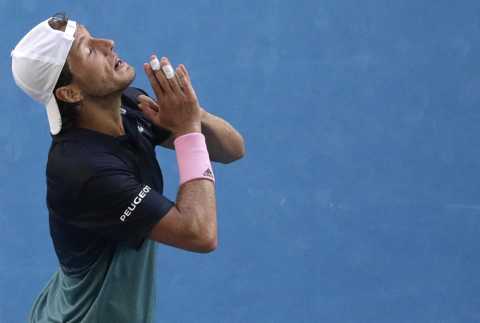 France's Lucas Pouille celebrates after defeating Canada's Milos Raonic in their quarterfinal match at the Australian Open tennis championships in Melbourne, Australia, Wednesday, Jan. 23, 2019.(AP Photo/Kin Cheung)