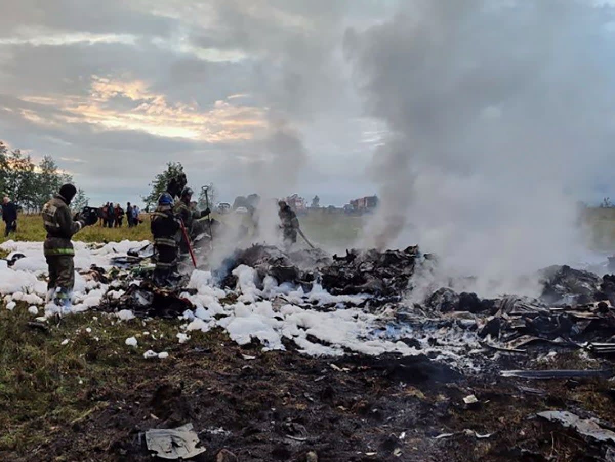 Emergency services on the site of the crash near the village of Kuzhenkino, Tver region (EPA)