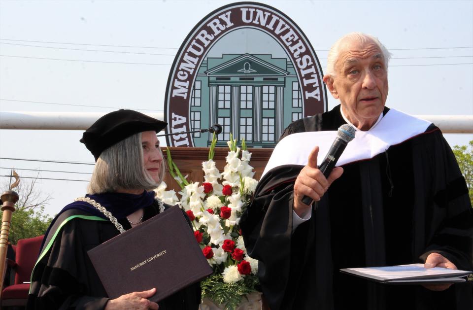 Author, photographer and McMurry University supporter Bill Wright encourages the younger students - he graduated 67 years earlier, he said - in making their way and making a difference by "paying if forward" after being awarded a Doctor of Humane Letters at ceremonies Saturday morning at Wilford Moore Stadium. He was presented is doctorate by Dr. Sandra Harper, left, university president and Dr. Matt Draud.