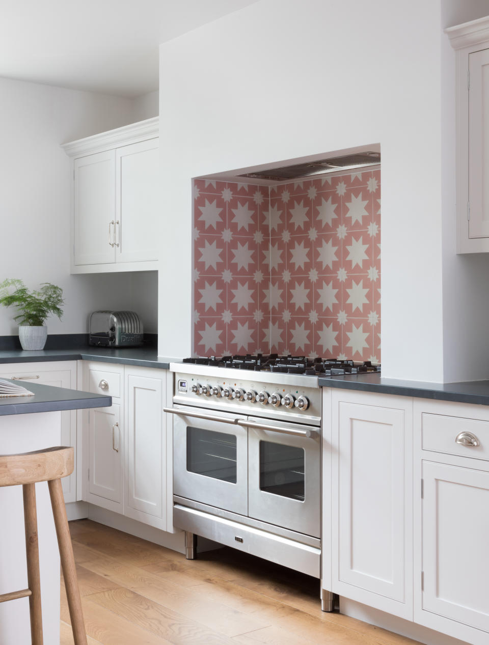 <p> Create a colourful backsplash behind your range or cooker with tiles that contrast with the rest of your kitchen scheme. This works especially well against cabinets painted in a pale or neutral tone, adding personality to your space. </p> <p> With their tactile, chalky finish, fabulous patterns and relaxed vintage look, encaustic tiles are synonymous with country style.  </p> <p> Their geometric nature means they can be laid to create a variety of repeating patterns on both walls and floors for a unique finish. </p> <p> Go bold with clashing hues or opt for a classic combination, such as blue and white, for a more lived-in look.  </p>