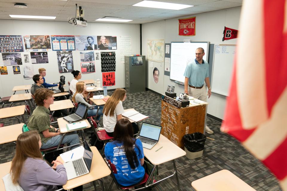 Seaman High School civics teacher Richard Rineberg teaches his morning class Friday where three students in the class — Jeremiah Moylan, Reece Mumford and Kylie Weir, as well as Sidney Chinn — competed in and won the Kansas Civics Games this year.