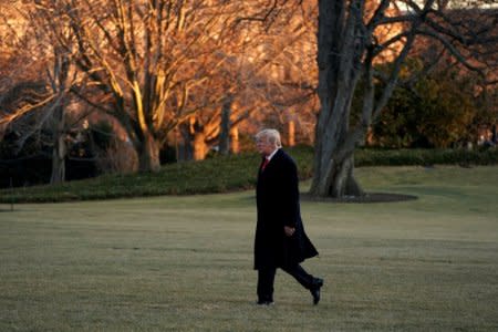U.S. President Donald Trump walks on South Lawn of the White House upon his return in Washington from Pittsburgh, U.S., January 18, 2018. REUTERS/Yuri Gripas