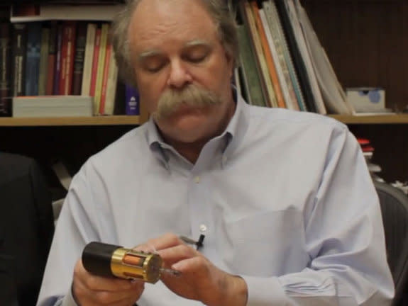 Ian Hunter, head of MIT's bioinstrumentation lab, shows off the lab's new painless jet injector.