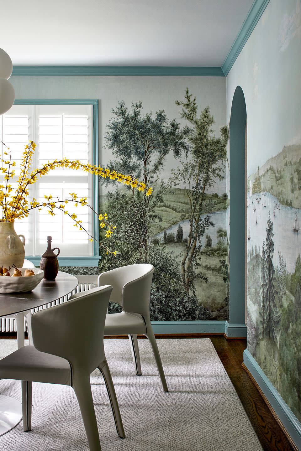 dining room with forest mural