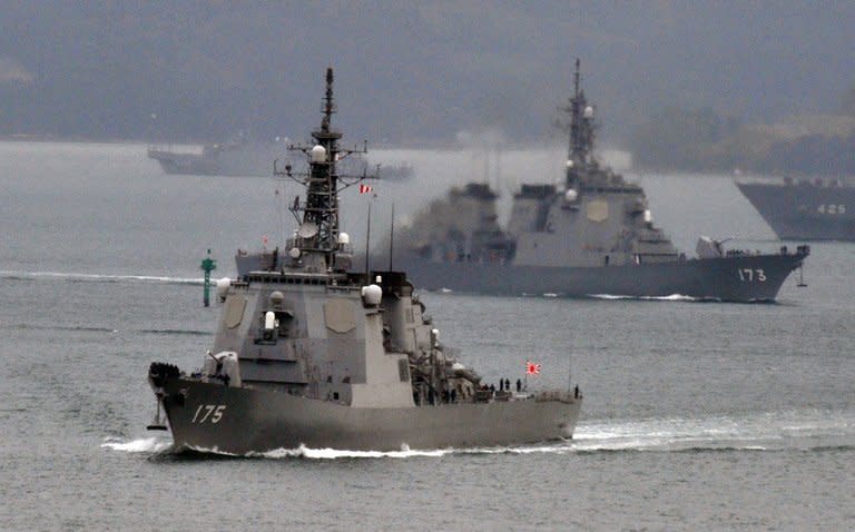 Japanese Maritime Defense Force's Aegis cruiser Myoko (L) and Kongo (R) leave the Sasebo naval base in Nagasaki prefecture on December 6, 2012. Defence Minister Satoshi Morimoto has ordered the military to prepare for the North Korean long-range rocket launch this month