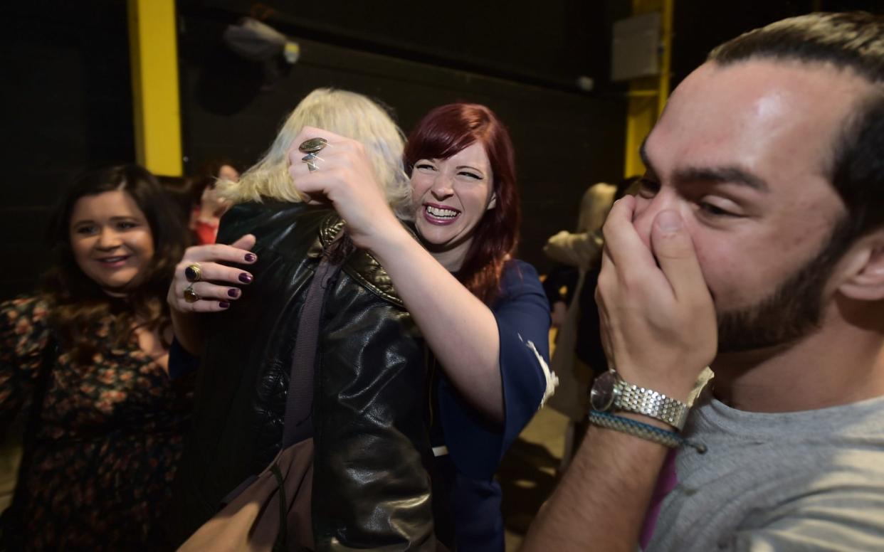 Yes campaigners hug one another as the count in the Irish referendum on the 8th amendment concerning the country's abortion laws takes place at the RDS centre - Getty Images Europe