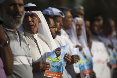 Bedouin demonstrators hold signs during a protest in the southern town of Rahat, Israel, in support of Islamic Jihad activist Mohammed Allan, who is in the ninth week of a hunger strike against his detention without trial, August 18, 2015. REUTERS/Amir Cohen