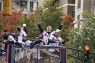 Atlanta Braves players celebrate the team's victory during a victory parade, Friday, Nov. 5, 2021, in Atlanta. The Braves beat the Houston Astros 7-0 in Game 6 on Tuesday to win their first World Series baseball title in 26 years. (AP Photo/Brynn Anderson)