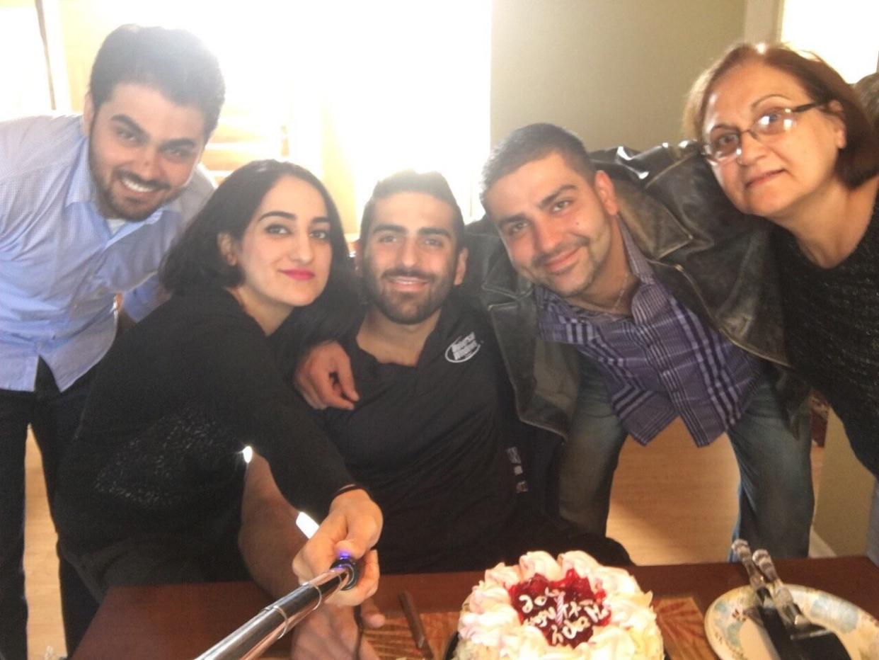 Mustafa Ayoubi (second from the right) and family pose for a photo. His sister Zahra is holding the selfie stick. (Photo: Photo provided by the Ayoubi family)