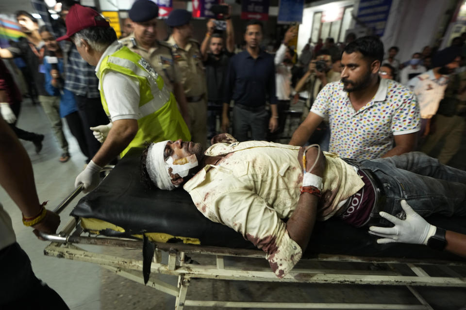 An injured man is brought to the Government Medical College Hospital in Jammu after the bus he was traveling in fell into a deep gorge in the Pouni area of Jammu's Reasi district, India, Sunday, June 9, 2024. Officials in Indian-controlled Kashmir say at least nine people have been killed after suspected militants fired at a bus with Hindu pilgrims, which then fell into a deep gorge. (AP Photo/Channi Anand)