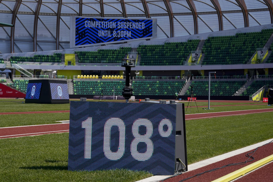 A sign displaying the current temperature is shown after events were postponed due to high heat at the U.S. Olympic Track and Field Trials Sunday, June 27, 2021, in Eugene, Ore.(AP Photo/Ashley Landis)