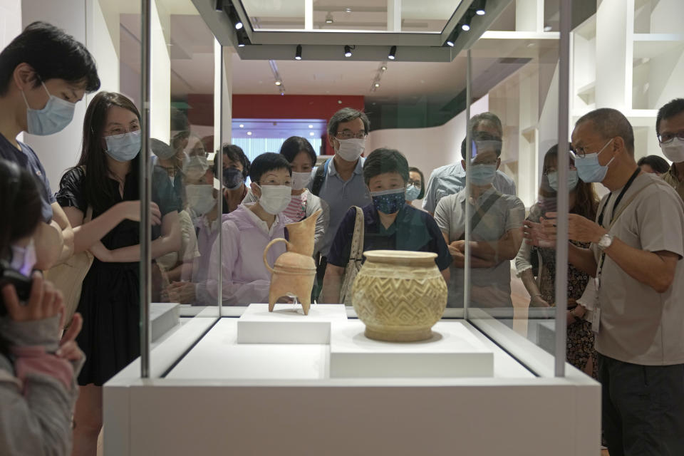 Visitors tour the Hong Kong Palace Museum during the first day open to public in Hong Kong, Sunday, July 3, 2022. It showcases more than 900 Chinese artefacts, loaned from the long-established Palace Museum in Beijing, home to works of art representing thousands of years of Chinese history and culture. (AP Photo/Kin Cheung)