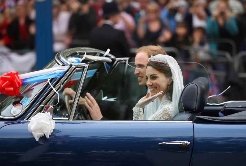 Prince William, Duke of Cambridge and Catherine, Duchess of Cambridge drive from Buckingham Palace in a decorated sports car on April 29, 2011 in London, England (Getty Images)