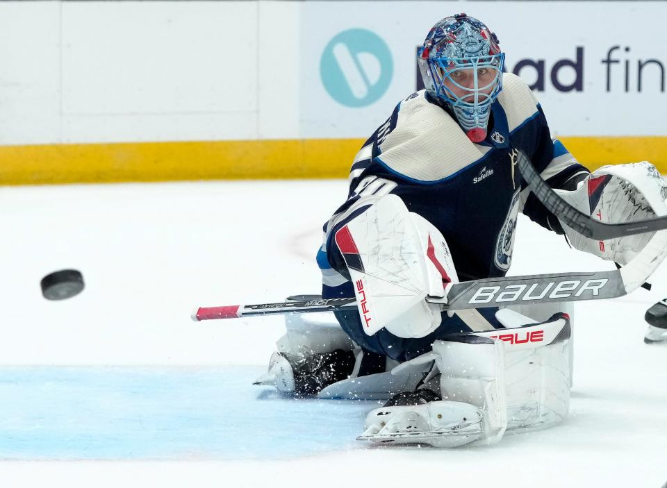 Feb. 25, 2024; Columbus, Ohio, USA; 
Columbus Blue Jackets goaltender Elvis Merzlikins (90) deflects a puck during the second period of an NHL game against the New York Rangers at Nationwide Arena on Sunday.