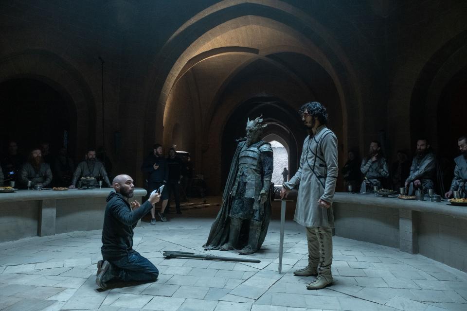 "The Green Knight" director David Lowery, left, Ralph Ineson and Dev Patel on the set in Ireland.