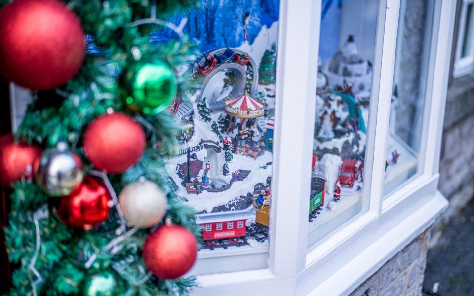 The shops on the main street are decorated with traditional Christmas displays