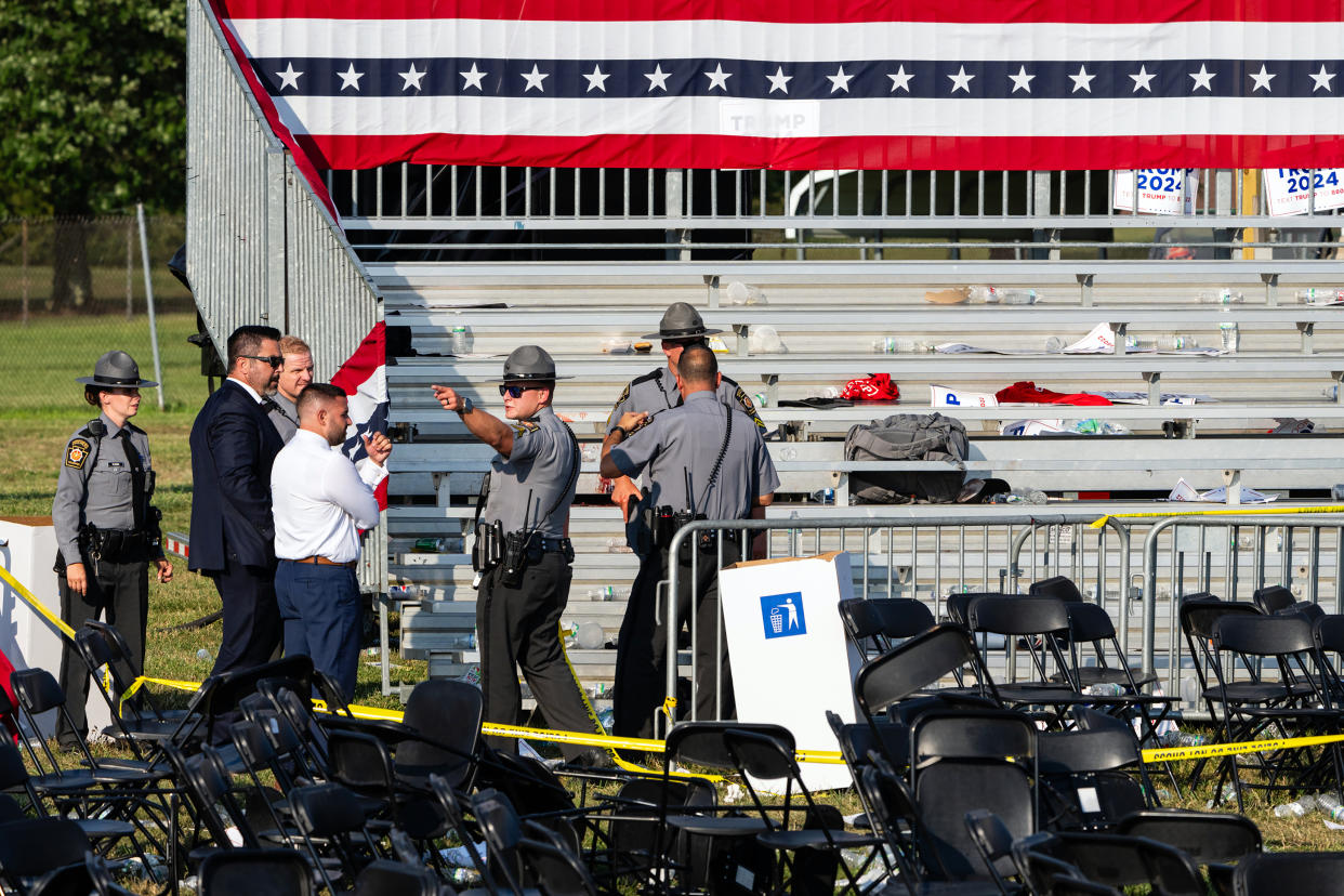 Law enforcement officers survey a scene after former President Donald Trump’s campaign event at Butler Farm Show Inc. in Butler, Pa., on Saturday, July 13, 2024.  (Eric Lee/The New York Times)