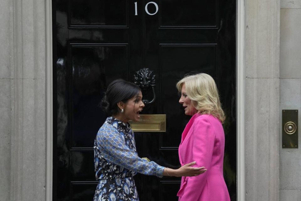Akshata Murty wife of the British Prime Minister greets the US First Lady Jill Biden on the doorstep of 10 Downing Street in London, Friday, May 5, 2023. The First Lady is in London to attend the Coronation of King Charles III, on Saturday May, 6.(AP Photo/Kin Cheung)