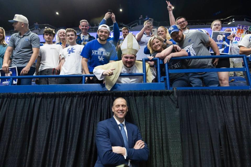 New Kentucky basketball head coach Mark Pope takes a photo with a fans dressed as in a papal costume after an introductory event at Rupp Arena in Lexington, Ky, Sunday, April 14, 2024.
