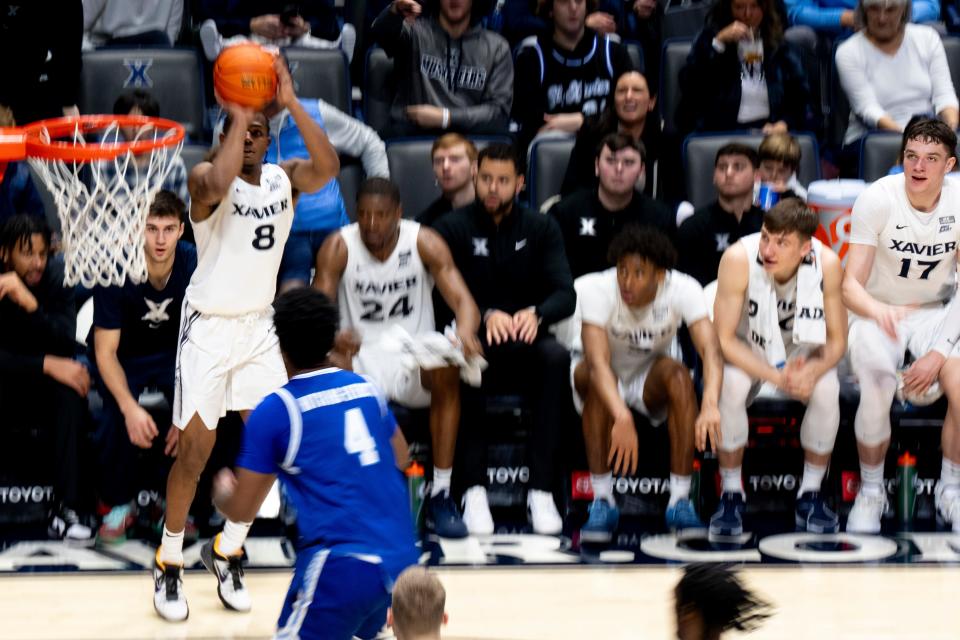 Xavier Musketeers guard Quincy Olivari (8) hits a 3-point basket in the second half of the basketball game between Xavier Musketeers and Seton Hall Pirates at the Cintas Center in Cincinnati on Saturday, Dec. 23, 2023.